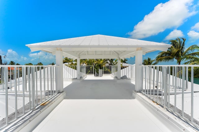view of patio featuring a gazebo and a carport