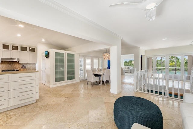 living area with crown molding, recessed lighting, ceiling fan, and french doors