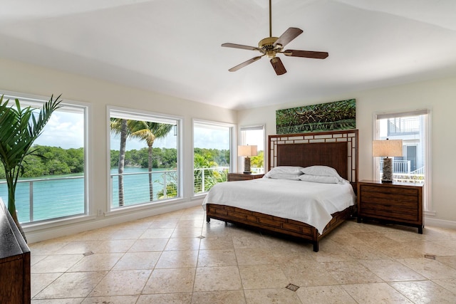bedroom featuring vaulted ceiling, ceiling fan, and baseboards