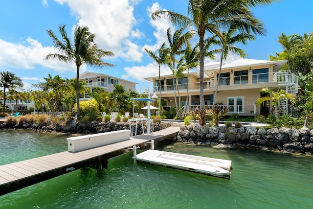 dock with a water view and a balcony