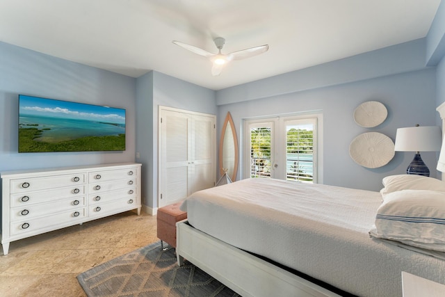 bedroom featuring access to exterior, a closet, a ceiling fan, and baseboards