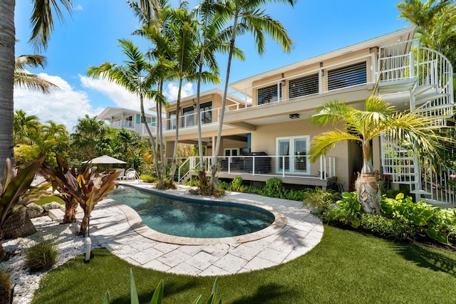 outdoor pool with a lawn
