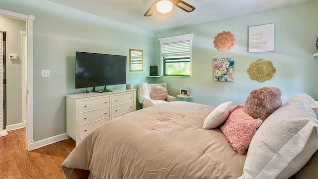 164 Tortuga Ln, Cudjoe, FL 33042 - bedroom with baseboards, wood finished floors, and a ceiling fan