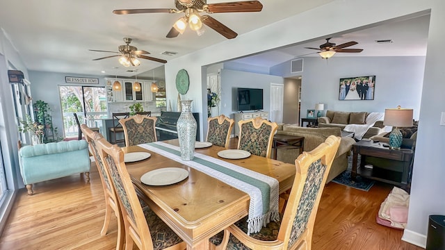 164 Tortuga Ln, Cudjoe, FL 33042 - dining space featuring visible vents, ceiling fan, and light wood-style flooring