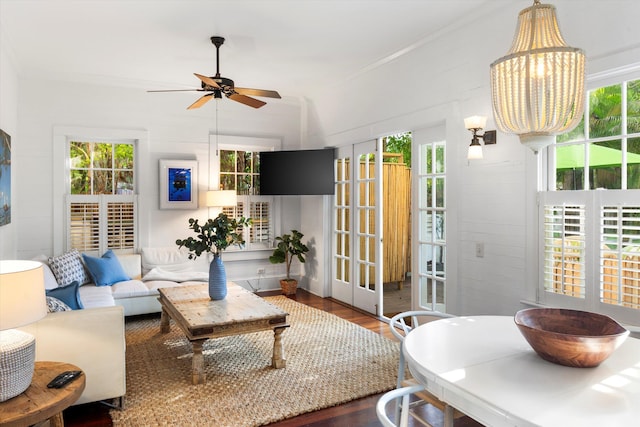 living room featuring ornamental molding, dark hardwood / wood-style floors, and ceiling fan