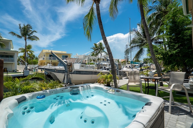 19 N Dr, Key Largo, FL 33037 - view of swimming pool featuring a hot tub and a dock