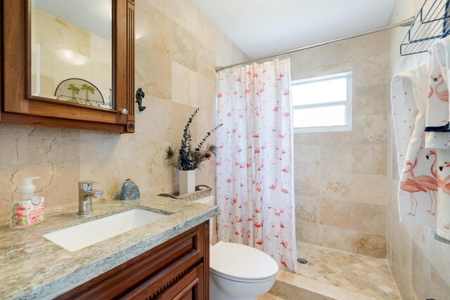 19 N Dr, Key Largo, FL 33037 - bathroom with vanity, a tile shower, and tasteful backsplash