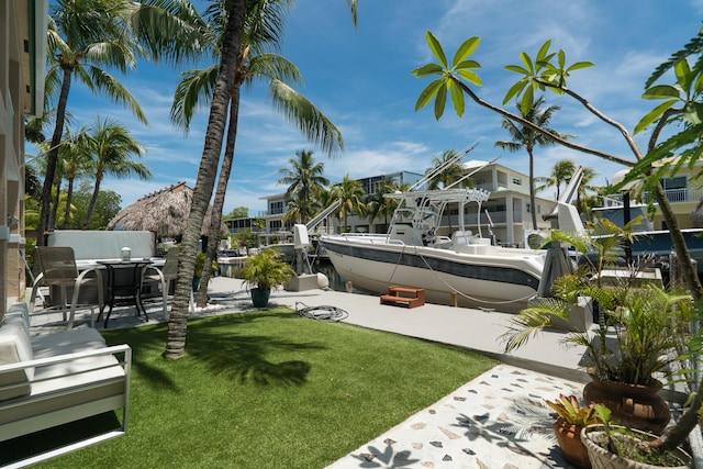 19 N Dr, Key Largo, FL 33037 - view of grassy yard featuring a boat dock