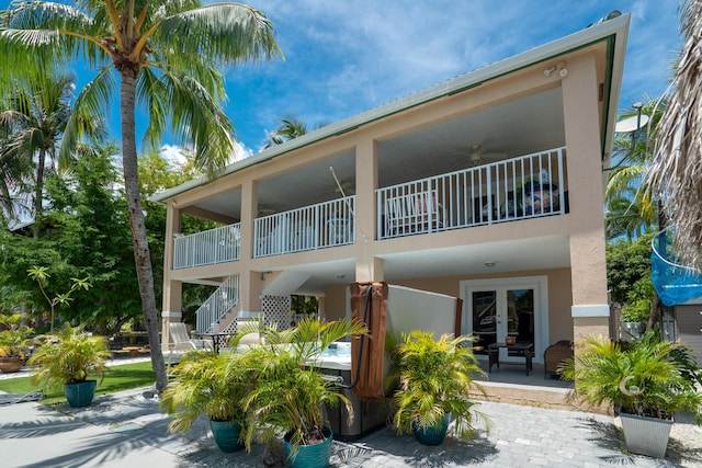 19 N Dr, Key Largo, FL 33037 - rear view of property with french doors, a ceiling fan, stucco siding, and a balcony