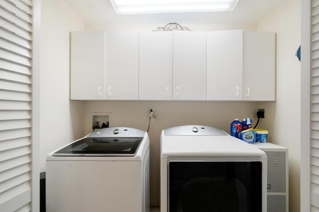 19 N Dr, Key Largo, FL 33037 - laundry area featuring washing machine and clothes dryer and cabinet space