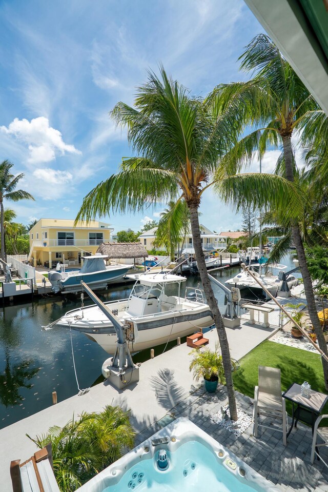19 N Dr, Key Largo, FL 33037 - view of pool featuring a boat dock and a water view