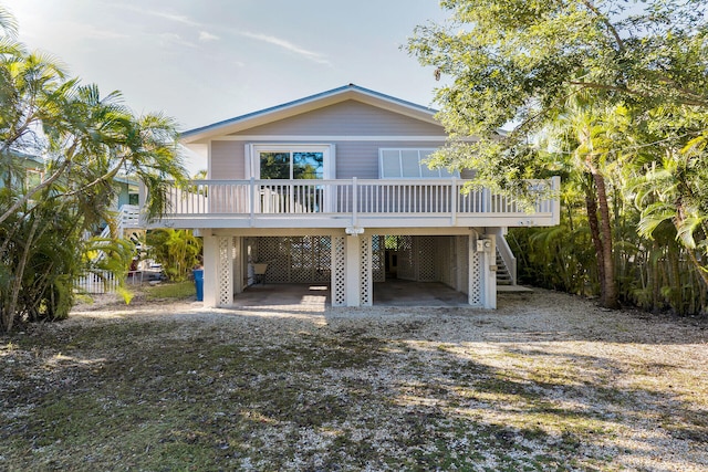 coastal inspired home featuring a carport