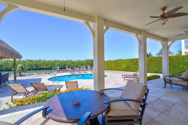 2394 Coco Plum Dr Unit 2, Marathon, FL 33050 - view of patio featuring a ceiling fan, an outdoor pool, and outdoor dining area