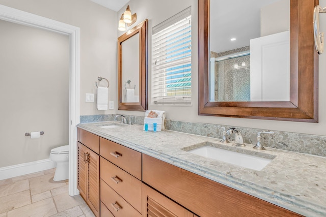 2394 Coco Plum Dr Unit 2, Marathon, FL 33050 - bathroom with double vanity, a stall shower, and stone tile flooring
