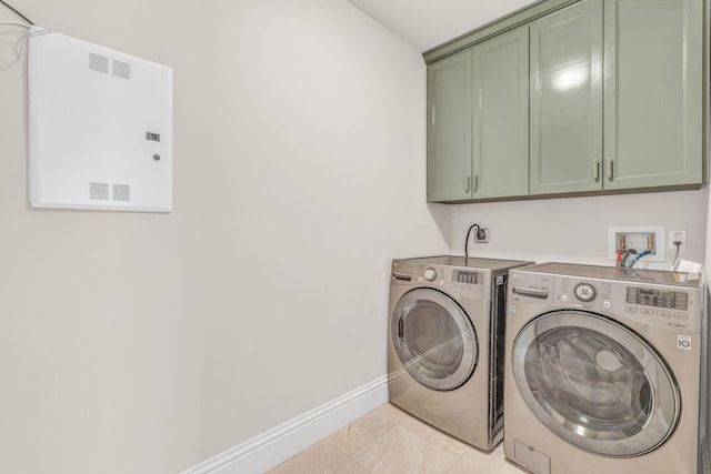 2394 Coco Plum Dr Unit 2, Marathon, FL 33050 - laundry room featuring washing machine and clothes dryer and cabinet space