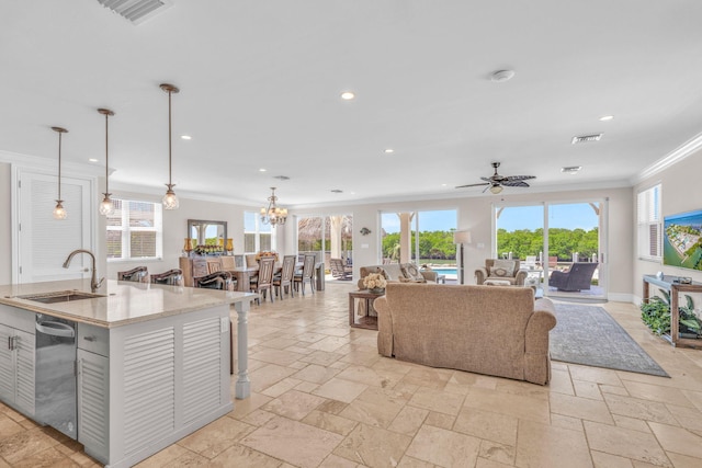 2394 Coco Plum Dr Unit 2, Marathon, FL 33050 - living area with ornamental molding, stone tile flooring, recessed lighting, ceiling fan, and a chandelier