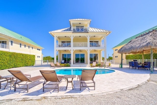 2394 Coco Plum Dr Unit 2, Marathon, FL 33050 - back of property featuring a standing seam roof, ceiling fan, a metal roof, a patio area, and a balcony