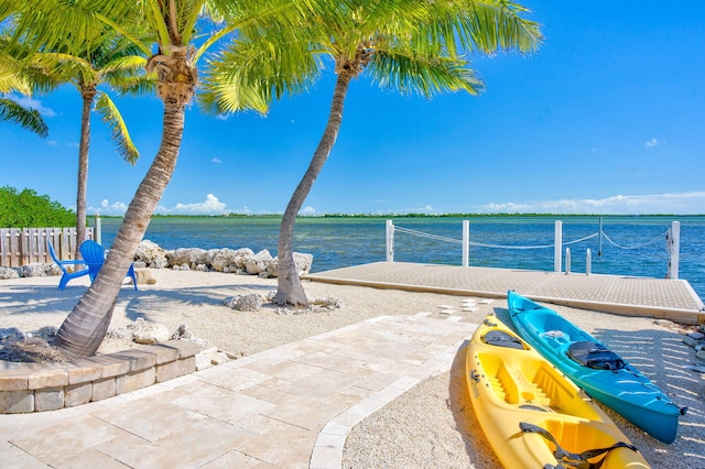 view of patio with a water view