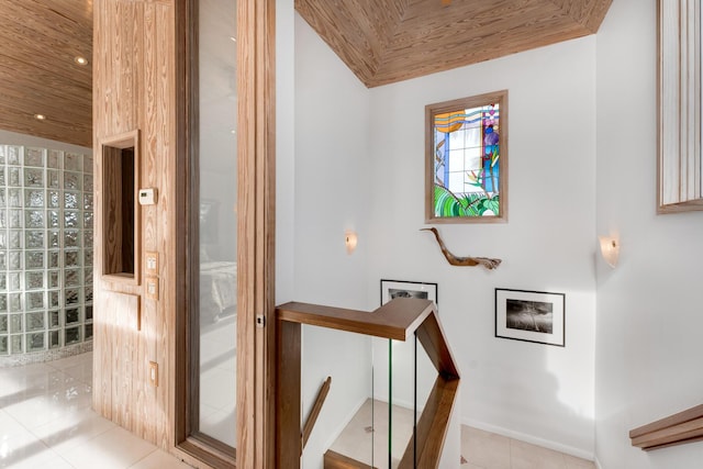 interior space featuring tile patterned flooring and wooden ceiling