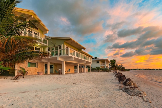 exterior space featuring a water view and a balcony