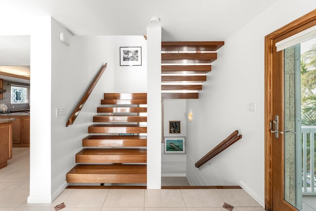 staircase with tile patterned floors