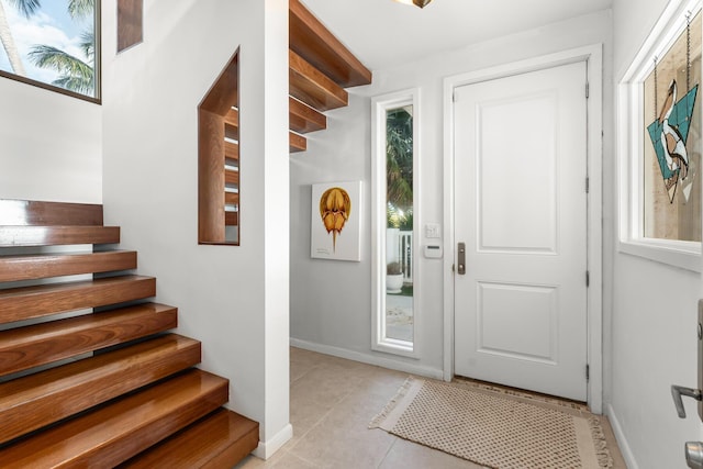 foyer entrance featuring light tile patterned floors