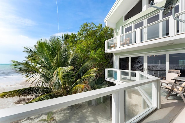 exterior space featuring a water view and a balcony