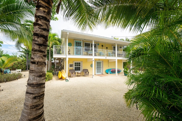 back of house with a patio