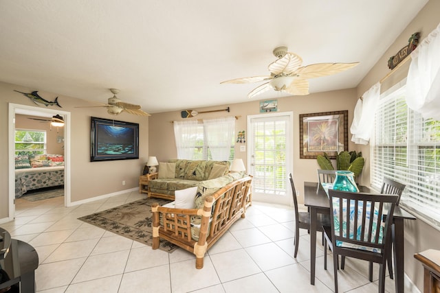 tiled living room with ceiling fan and a healthy amount of sunlight