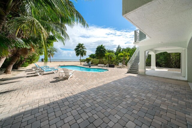 view of pool featuring a patio