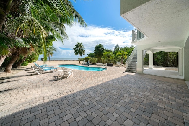 view of pool featuring a patio