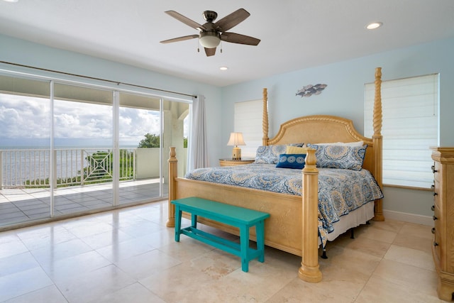 bedroom featuring access to outside, ceiling fan, and a water view