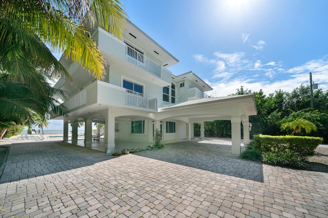 rear view of property with a balcony