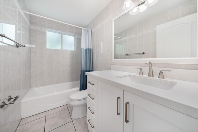 full bathroom featuring tile walls, vanity, toilet, shower / bath combo, and tile patterned floors