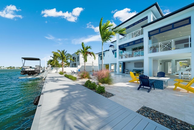 16745 Tamarind Rd, Sugarloaf, FL 33042 - exterior space with a water view, a patio area, fence, and boat lift