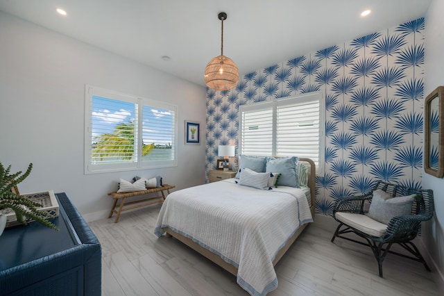 16745 Tamarind Rd, Sugarloaf, FL 33042 - bedroom featuring recessed lighting, an accent wall, multiple windows, and wallpapered walls