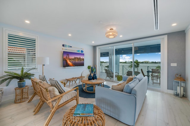 16745 Tamarind Rd, Sugarloaf, FL 33042 - living area featuring a wall of windows, baseboards, recessed lighting, and light wood-style flooring