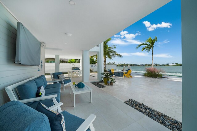 16745 Tamarind Rd, Sugarloaf, FL 33042 - view of patio with an outdoor living space, a water view, and outdoor dining area