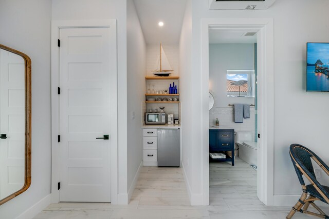 16745 Tamarind Rd, Sugarloaf, FL 33042 - hallway featuring recessed lighting, baseboards, and marble finish floor