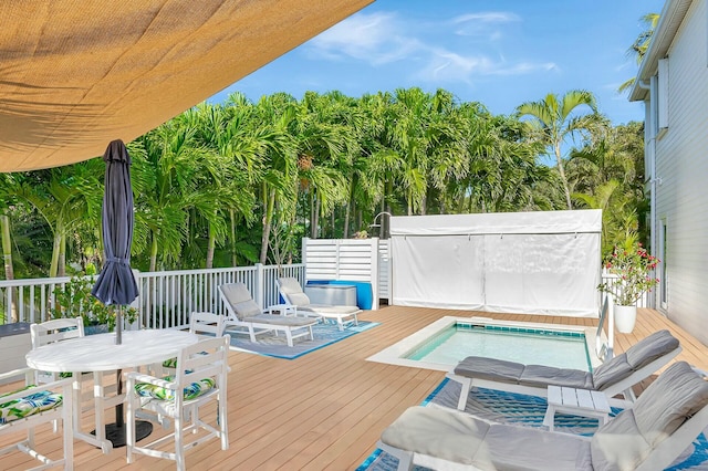 wooden terrace with a swimming pool