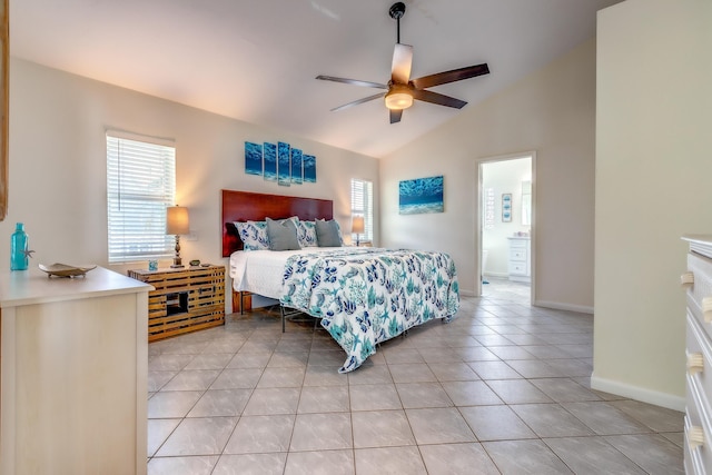 bedroom featuring multiple windows, light tile patterned floors, lofted ceiling, and ceiling fan