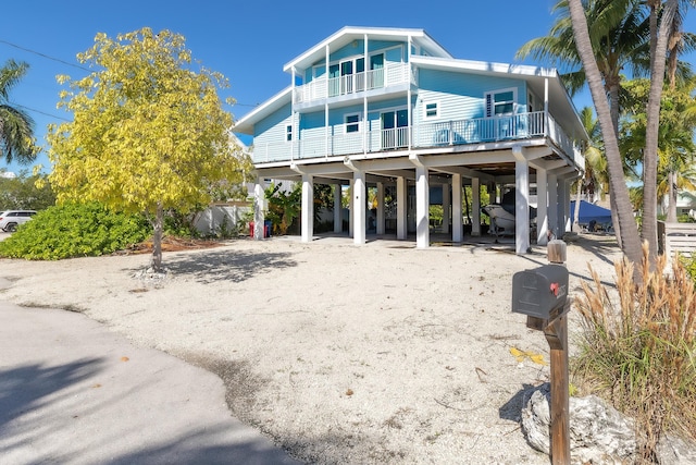 exterior space featuring a carport and a balcony