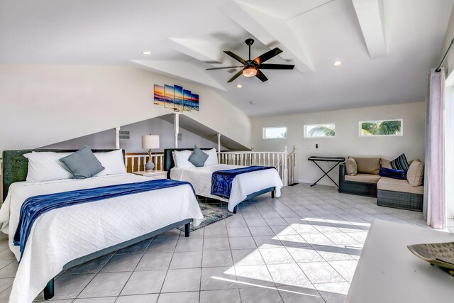 tiled bedroom featuring lofted ceiling and ceiling fan