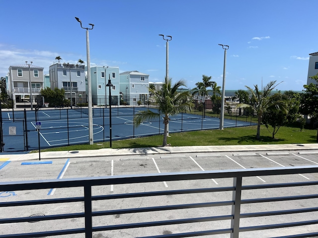 exterior space with basketball court and tennis court