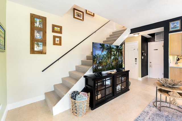 stairs featuring tile patterned flooring