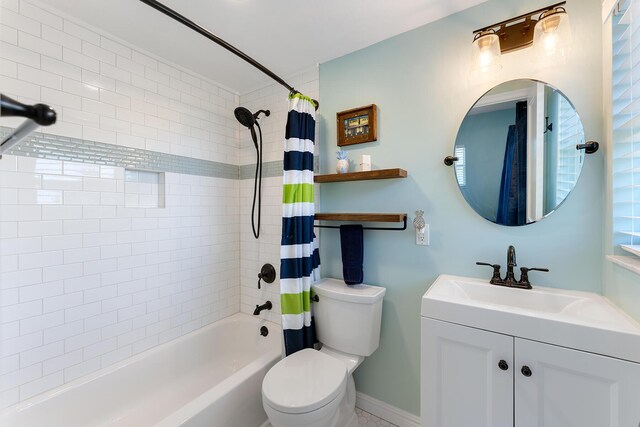 full bathroom featuring vanity, toilet, and shower / bath combo with shower curtain