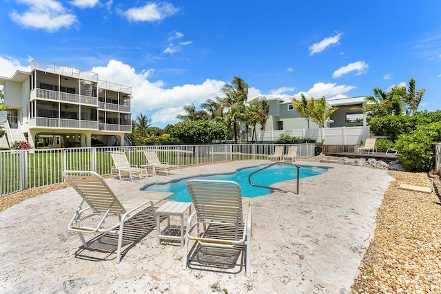 view of swimming pool with a patio area