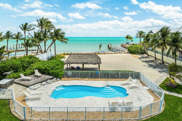 view of swimming pool featuring a deck with water view