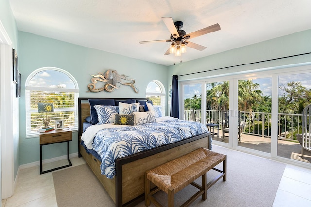 tiled bedroom with ceiling fan and access to exterior