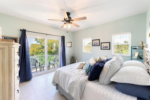 tiled bedroom with multiple windows, access to exterior, and ceiling fan